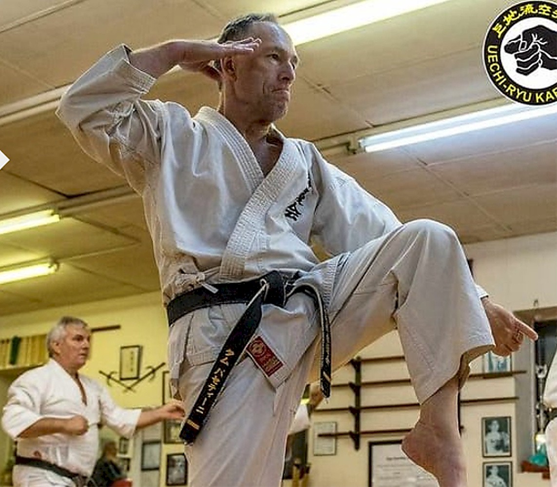 Instructor demonstrating karate technique